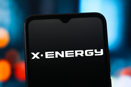 In this photo illustration, the X Energy logo is seen displayed on a smartphone screen.
