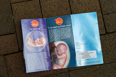 An anti-abortion pamphlet is seen on the ground about a block away from Planned Parenthood of Western Pennsylvania.