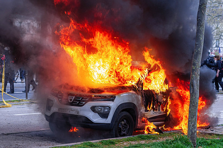 A car set on fire by protesters on the Boulevard Raspail during the demonstration. Unions in France, last week called for an 11th day of action for today. They consider ‘the lack of response from the government leads to a situation of tension of great concern” Unions said in a statement, they were calling “for local union rallies and a new big day of strikes and demonstrations throughout the country.” Protesters over the past two-weeks have clashed with police over the French government pension reform policy. President Emmanuel Macron decided to push through the controversial reforms to raise the retirement age from 62 to 64 without a parliamentary vote. Marine Le Pen, leader of the National Rally MPs in parliament, called the decision to push through the pension changes "a total failure for the government".