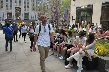 People walk in Rockefeller Center, Manhattan, New York City.