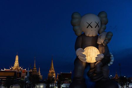 An inflatable art sculpture " COMPANION" seen being displayed near the Grand Palace during the KAWS: Holiday Thailand exhibition at Sanam Luang in Bangkok. The KAWS: Holiday exhibition displays the iconic 18 meter tall inflatable art sculpture " COMPANION" that was created by an American artist Brian Donnelly also known as KAWS at Sanam Luang in Bangkok as the part of the “KAWS: HOLIDAY” world tour.