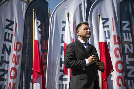 Slawomir Mentzen far-right presidential candidate, speaks during his rally in Warsaw ahead of the upcoming presidential election. Polish far-right presidential candidate Slawomir Mentzen held a meeting with his supporters in the center of Warsaw as part of his campaign rally ahead of the presidential elections scheduled for 18 May 2025.
Slawomir Mentzen, member of the Confederation (Konfederacja) political party has emerged as a prominent figure in Poland’s presidential race, leveraging his savvy use of social media platforms like TikTok to connect with younger voters.
His sleek videos and populist messaging have resonated with many young people, especially men, propelling his visibility nationwide. Beyond the digital realm, Mentzen has been actively touring the country, aiming to broaden his appeal to older demographics. 
He is currently in third place in the polls in the upcoming first round of the presidential elections, which will be held on May 18, 2025, and is thus chasing second place to Karol Nawrocki - the candidate supported by Law and Justice.
