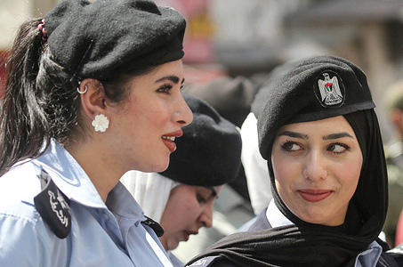 Palestinian policewomen attend a military parade marking the 31st anniversary of the founding of the Palestinian Police in the Palestinian Authority territories. The Palestinian Authority was formed on 4 May 1994, as part of the Oslo accords which sought to broker a peace agreement between Israel and the Palestine Liberation Organisation (PLO).
