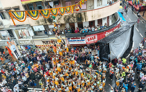 Hindu devotees form a pyramid to break dahi handi (earthen pot filled with curd) during the Janmashtami festival celebration. The festival of Janmashtami is celebrated across the country to mark the birth of Hindu god Krishna. Devotees gather on the streets forming acrobatic pyramids to break dahi handi (earthen pot filled with curd) celebrating the occasion.