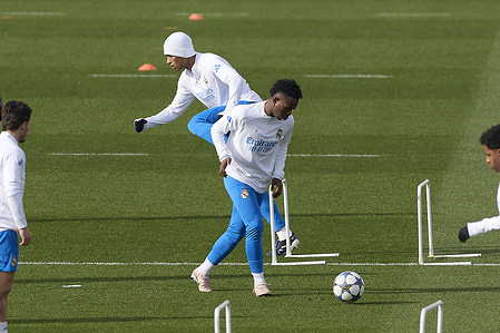 Jude Bellingham (L) and Vinicius Junior (R) of Real Madrid CF seen in action during a training session on the eve of the UEFA Champions League 2025/2026 at Ciudad Real Madrid.