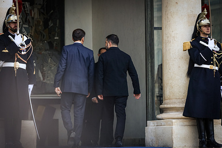 The French President Emmanuel Macron (L) and Volodymyr Zelensky (R), the President of Ukraine, enter at the Elysee Palace. The French President Emmanuel Macron met with Volodymyr Zelensky, the President of Ukraine, at the Elysée Presidential Palace, in Paris. This visit will reaffirm France's long-term commitment to Ukraine and maintain the momentum of the work undertaken on the issue of security guarantees within the framework of the Coalition of the Willing.
