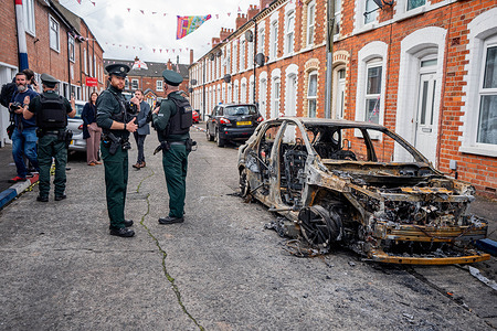 Police officers were seen inspecting the burnt-out cars and buildings in the Templemore area. The city erupted into flames as locals took to the streets to protest against the stabbing of a North Belfast man by a Sudanese national refugee.  Road blockades were set up all over Belfast, bringing much of the city to a standstill. The protestors are demanding a stop to immigration into Northern Ireland.