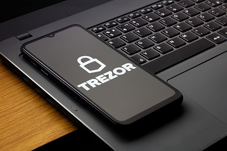 In this photo illustration, the Trezor logo is seen displayed on a smartphone screen.