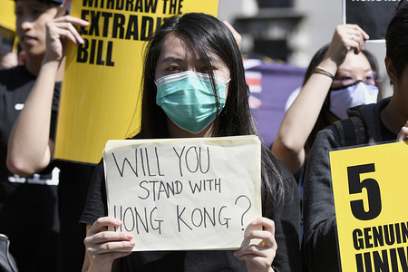 Pro-Hong Kong democracy protester holds a placard during the demonstration in London.
Protesters rallied at Trafalgar Square to demand for democracy and justice in Hong Kong and urged to the UK parliament to legislate for sanctions against those responsible for human rights violations in Hong Kong. Counter-protesters gathered near the rally and attempted to disrupt the protest.
