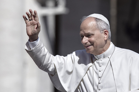 Pope Leo XIV greets the faithful as he arrives for the Jubilee of Justice in St. Peter's square.