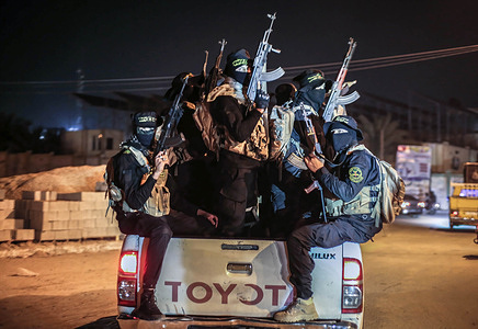 Palestinian gunmen from Saraya al-Quds, the military wing of Islamic Jihad, seen on a truck during a military parade in the southern Gaza Strip. Israeli security forces killed three Islamic Jihad activists earlier near the city of Jenin in the northern West Bank.
