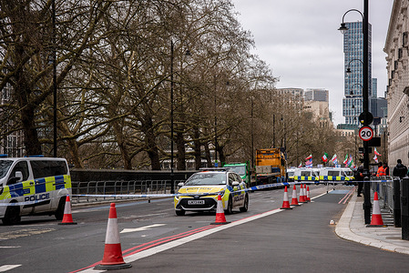 The Metropolitan Police stand on guard during the Pro Iran Regime Change Rally in London.