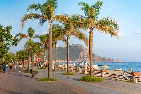 The palm tree lined sea cycle path beside Cleopatra beach, Alanya peninsula on the Turkish Mediterranean.