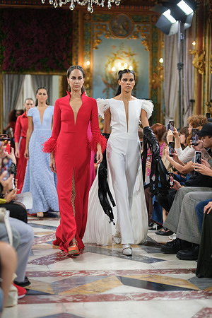 Models showcase Esther Noriega design during the Atelier Couture bridal catwalk within Madrid Fashion Week, held at Santa Isabel Palace in Madrid.