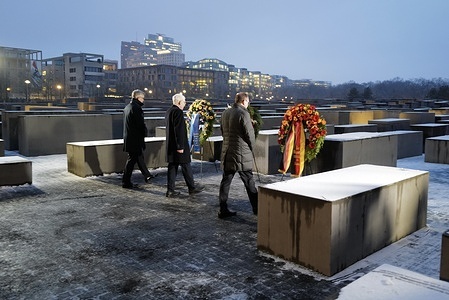 Josef Schuster, Head of the Council of Jews in Germany, (C) Alexander Dobrindt, (R) German Foreign Minister and Magnus Brunner (L) EU Commissioner pay respect to the victims of the Holocaust in a cemetery during the event. The International Holocaust Remembrance Day is an international memorial day on 27 January that commemorates the systematic extermination of 6 million Jews, representing two-thirds of Europe's Jewish population, alongside the deaths of millions of others perpetrated by the Nazi regime and its collaborators between 1933 and 1945. This day is observed each year to commemorate the liberation of Auschwitz-Birkenau, the largest Nazi concentration and extermination camp.