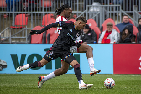 Zane Monlouis #12 (B) of Toronto FC and Rafael Navarro #10 (F) of Colorado Rapids in action during the MLS game between Toronto FC and Colorado Rapids at BMO field. The game ended 3-2 for Toronto FC.