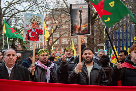 Protesters hold signs during the demonstration in Leicester Square. One of them shows a photo of the United States Ambassador to Turkey, Tom Barrack. Around 100 protesters from the Kurdish diaspora gathered in Leicester Square, calling on the UK government to take action against the Syrian military’s offensive in Kurdish-held areas of northeast Syria (Rojava).