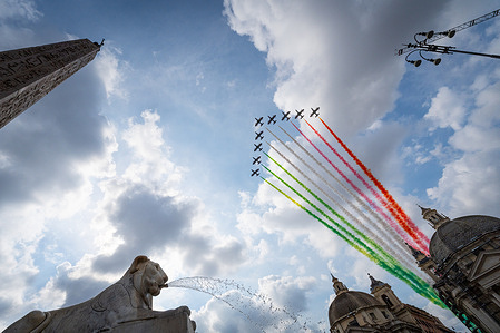The Italian Air Force acrobatic team "Frecce Tricolori" seen flying over downtown during celebrations for the Italian Republic Day.