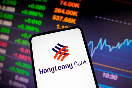 In this photo illustration, the Hong Leong Bank Berhad logo is displayed on a smartphone screen.
