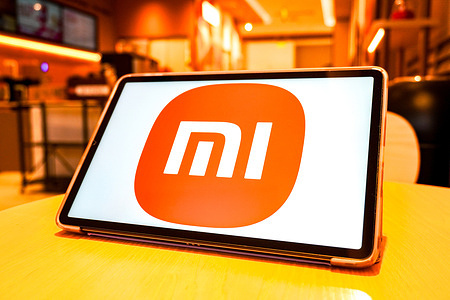In this photo illustration, a Xiaomi company logo is displayed on the screen of a smart tablet.