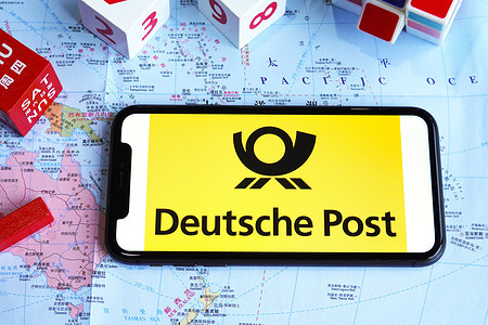 In this photo illustration, a Deutsche Post logo is displayed on the screen of a smartphone.