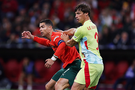 Robin Le Normand of Spain (R) seen in action with Cristiano Ronaldo of Portugal (L) during the UEFA Nations League 2025 final match between Portugal and Spain at Munich Football Arena. Final score: Portugal 2–2 Spain (Portugal win 5–3 on penalties)