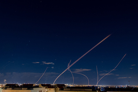 An Israeli Air defense system intercepts a ballistic missile barrage launched from Iran to central Israel during the missile attack.
