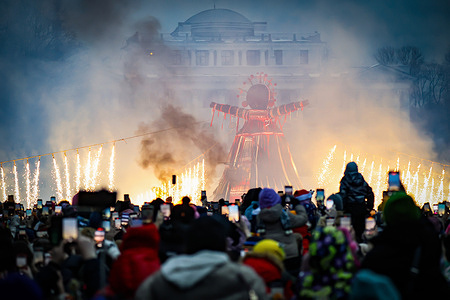 People look at the effigy on Elagin Island during the Maslenitsa celebrations. Maslenitsa is an ancient Russian holiday celebrated at the end of winter, symbolizing the arrival of warmer days. The tradition dates back to pre-Christian Rus' and was associated with pagan rituals dedicated to the sun and fertility. Burning an effigy symbolizing winter meant the arrival of spring and deliverance from misfortune. Today, the holiday is celebrated throughout Russia with pancakes, festivities, and the sharing of traditions.