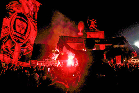 Soccer fans light flares in memory of the football riot. Indonesian football fans pay their respects by lighting candles in Jakarta. At least 125 people have been killed and around 320 injured at a football match in Indonesia in one of the world’s worst ever sports stadium disasters. Police used teargas in response to a pitch invasion by rioting fans, causing a crush among panicked spectators. Officers and organisers are facing scrutiny over the tragedy, including questions over the use of teargas inside the venue, which is contrary to Fifa guidance. The incident occurred after a match in which the Javanese club Arema were defeated by their rivals Persebaya Surabaya at Kanjuruhan stadium in Malang regency, East Java on Saturday night.