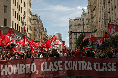 Protesters carry a banner during a demonstration organized by the General Union of Workers (UGT) and Workers' Commissions (CCOO) in downtown Madrid to commemorate May 1st, International Workers' Day.