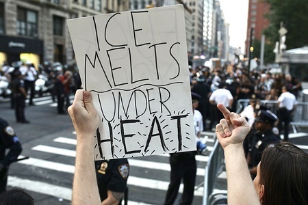 (EDITOR'S NOTE; Image contains profanity)
A protester holds a sign that reads "Ice melts under Heat," in reference to the U.S. Immigration and Customs Enforcement agency (ICE). Hundreds of protesters gathered near a building housing an immigration court in Downtown to protest against Trump's immigration crackdown. These demonstrations were sparked by anti-ICE protests that started early June in Los Angeles.