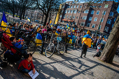 A Ukrainian woman is seen giving a speech asking for help to stop the war in her country during the demonstration. Ukrainian people gathered in front of the European Commission Representative Office, in The Hague to protest against Russia's invasion of the Ukraine and to appeal for the EU to fast-track Ukraine's membership application. On March 10th, at a summit in Versailles France, the EU bloc decided not fast-track membership for Ukraine despite support for the move from eastern member states like Estonia, Latvia, Lithuania, Hungary and Poland.