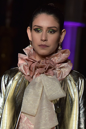 A model walks at the Hip Curve Fashion Show LFW - AW 22/23 at St John the Baptist Church in London.