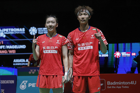 Jiang Zhen Bang (R) and Wei Ya Xin of China celebrate victory after winning against Jesper Toft and Amalie Magelund of Denmark (not pictured) during the Mixed Doubles semi-final match of the Petronas Malaysia Open 2026 at Axiata Arena. Jiang Zhen Bang and Wei Ya Xin won with scores; 21/21 : 15/14.