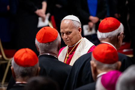 Pope Leo XIV leaves after the Vigil for Peace at St. Peter's Basilica .