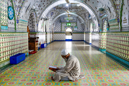 An Imam is seen sitting inside the mosque while reading the holy Qur'an during the holy month of Ramadan.Ramadan is the Islamic calendar's holistic month in which devotees are fasting from dawn until dusk.Muslims around the world are celebrating the month of Ramadan and have found various ways to celebrate this month of Ramadan, as restrictions placed by countries to curb the spread of Coronavirus have closed mosques to prevent gatherings.