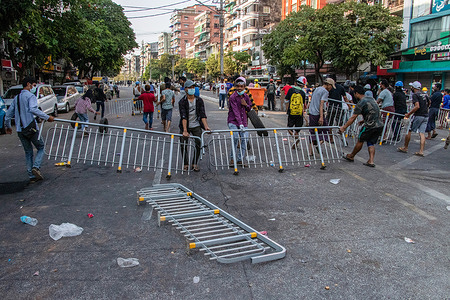 Anti military coup protesters setting up barricades to protect themselves against the police during a demonstration against the military coup.
Myanmar police and military fired rubber bullets, tear gas and sound bombs at peaceful anti military coup protesters on Tuesday. Several were arrested and injured including rescue volunteers, but the exact number is still unclear.
Myanmar's military detained State Counsellor of Myanmar Aung San Suu Kyi on February 01, 2021 and declared a state of emergency while seizing the power in the country for a year after losing the election against the National League for Democracy (NLD).