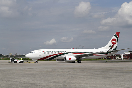 A Biman Bangladesh Airlines (BOEING 737-800) plane is seen at Hazrat Shahjalal International Airport (DAC) in Dhaka. Biman Bangladesh Airlines, commonly known as Biman, is the national flag carrier airline of Bangladesh. Established in 1972, Biman Bangladesh Airlines has its main hub at Hazrat Shahjalal International Airport in Dhaka, the capital city of Bangladesh. Biman Bangladesh Airlines plays a significant role in connecting Bangladesh with the rest of the world, contributing to the country's economic development and promoting tourism.