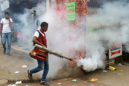 A Dhaka City Corporation worker fumigates the area to kill mosquitoes during a Campaign in Dhaka.Dhaka City Corporation (North) arranged an anti-dengue campaign to raise awareness against mosquito-borne dengue which has spread all over the country.