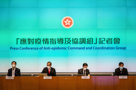 Deputy Secretary for Health (Special Duties) Vincent Fung (L1), Secretary for Health Professor Lo Chung-mau (L2), Chief Executive John Lee Ka-chiu (L3) and Secretary for transport and logistics Lam Sai-hung (L4) attend a press conference announcing the relaxation of mandatory quarantine policy at the government headquarters. The Hong Kong government announced that it will scrap hotel quarantine for inbound travellers from Sept. 26, the most substantial move yet in the city's push to end its isolation and salvage its status as a global financial center.