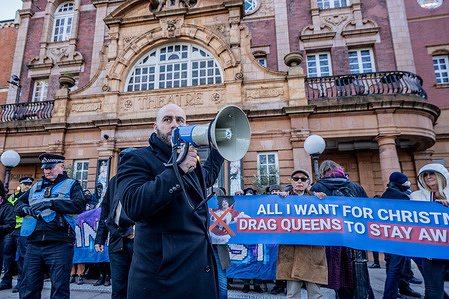 Leader of the UKIP Party Nick Tenconi chants slogans on a megaphone during a protest outside Richmond Theatre in West London, against a counter-demonstration by members of London's queer community. UKIP’s far-right supporters were protesting against a sold-out show for young children performed by a drag queen called Tania LeCoq. Members of London’s queer community staged a counter-protest outnumbering the UKIP supporters considerably.