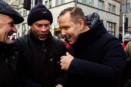 The presidential candidate for the Law and Justice Party, Karol Nawrocki, shares a joke with protestors during a demonstration. On January 3, Polish farmers and agricultural workers protested in Warsaw during the ceremonial start of Poland's EU presidency. As Ursula von der Leyen attended the Opening Gala at the National Theatre, protestors marched from the European Commission building to the theatre, voicing demands to halt food imports from Mercosur and Ukraine, oppose the Green Deal, protect Polish forests, and safeguard the economy. Presidential candidate Karol Nawrocki of the Law and Justice Party was among the notable speakers.
