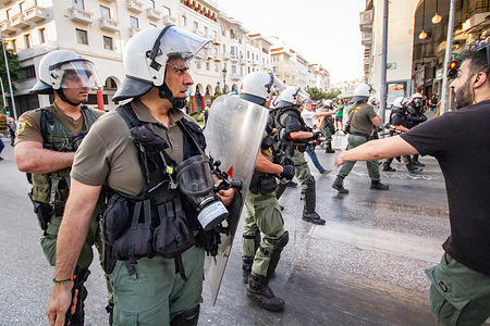 Greek riot police argue with protesters during a march in support of the crew of the Madlleen in the city. Greek people gathered to show support for the crew of The Madleen, a vessel reportedly seized by Israeli forces in the Mediterranean. The demonstration highlighted growing concern over Israeli maritime actions in the region.