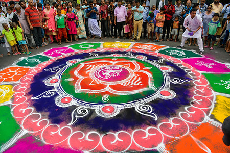 Devotees paint a mural as they celebrate during a Festival.
Rath Yatra is an annual event, which is celebrated in the month of June or July. It is dedicated to Lord Jagannath, his sister Goddess Subhadra and his elder brother Lord Balabhadra.