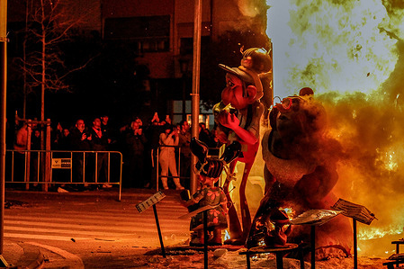 People observe figures of fallaes that burn completely with fire. More than 1 million tourists and more than 700 fallas in different parts of the city joined the last day of the Fallas Festival. Fallas is a traditional celebration held annually in Valencia, Spain, typically from March 15 to March 19. It is renowned for its elaborate and towering sculptures called "fallas," which are often satirical and criticize political figures and societal issues. The festival also features parades, fireworks, music, traditional costumes, and culinary delights. The highlight of Fallas is the burning of the fallas sculptures on the final night, known as "La Cremà," symbolizing the end of winter and the arrival of spring.