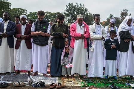 Muslim faithful seen praying during the Eid al-Fitr marking the conclusion of Ramadan's month-long fasting at Menengai High School grounds.