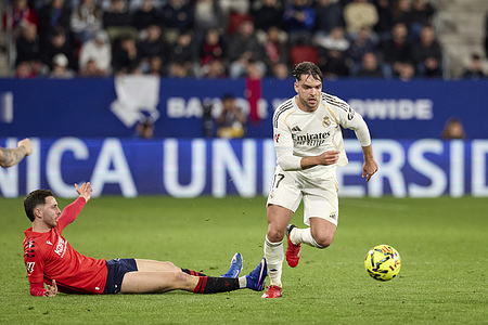 Raúl García de Haro of CA Osasuna (L) and Raul Asensio del Rosario of Real Madrid (R) seen in action during the LaLiga EA Sports between Osasuna and Real Madrid at Estadio El Sadar. Final score; Osasuna 2:1 Real Madrid.