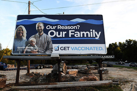 A billboard encourages people to get vaccinated for COVID-19 in Marion, the county seat of McDowell County. Only 48 percent of the population in the county is fully vaccinated.