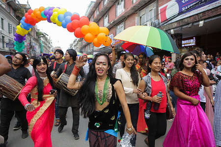 Participants march along the streets during the parade.
Nepal's LGBT community celebrates the Lesbian, Gay, Bisexual and Transgender (LGBT) pride parade annually to commemorate those who lost their lives due to pride rights.