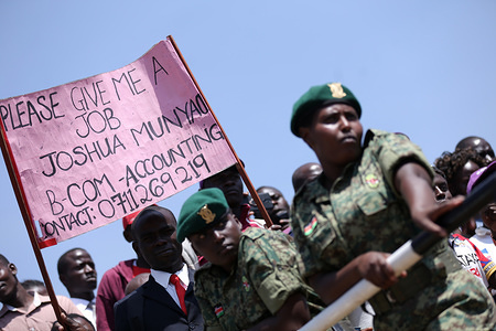 Middle-aged man seen holding a banner seeking for employment during the celebrations.
Kenyans celebrated Labour Day at Uhuru Park in Nairobi where some Youths protested against rampant corruption and poor leadership in Kenya. Unemployment and underemployment is widespread in the country.